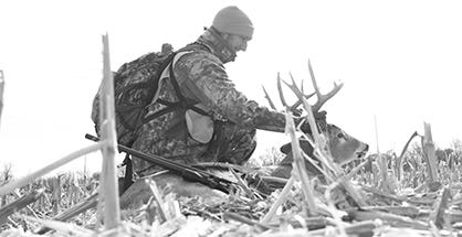 Hunter with Harvested Buck