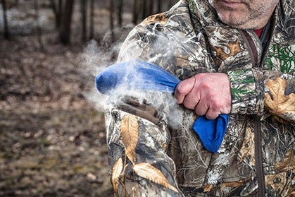 Hunter Using Scent Controlling Powder 