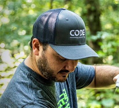 Hunter Wearing Code Blue Branded Hat